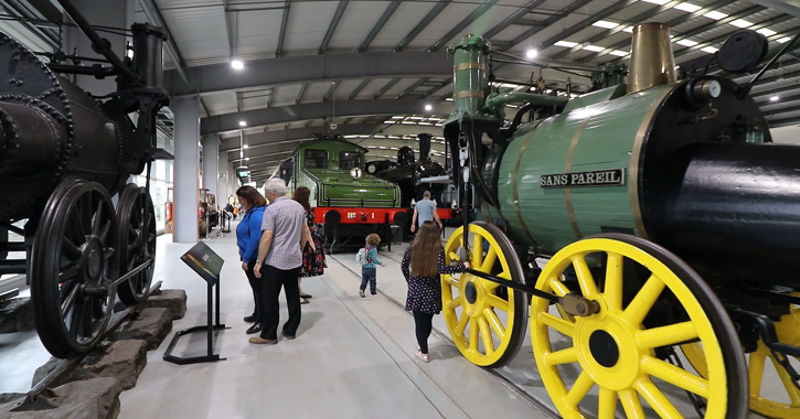 Multi-generation family walking through Locomotion Railway Museum